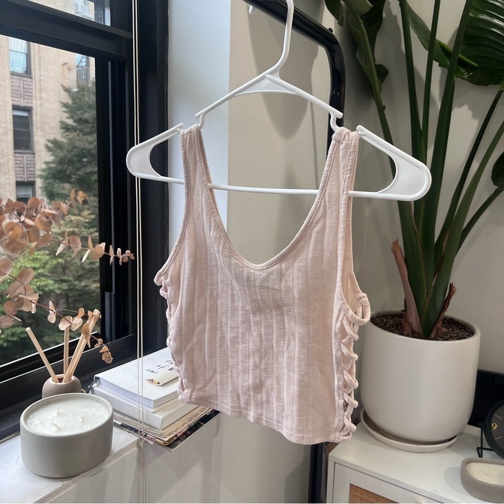 Blush crop top with crisscross at sides